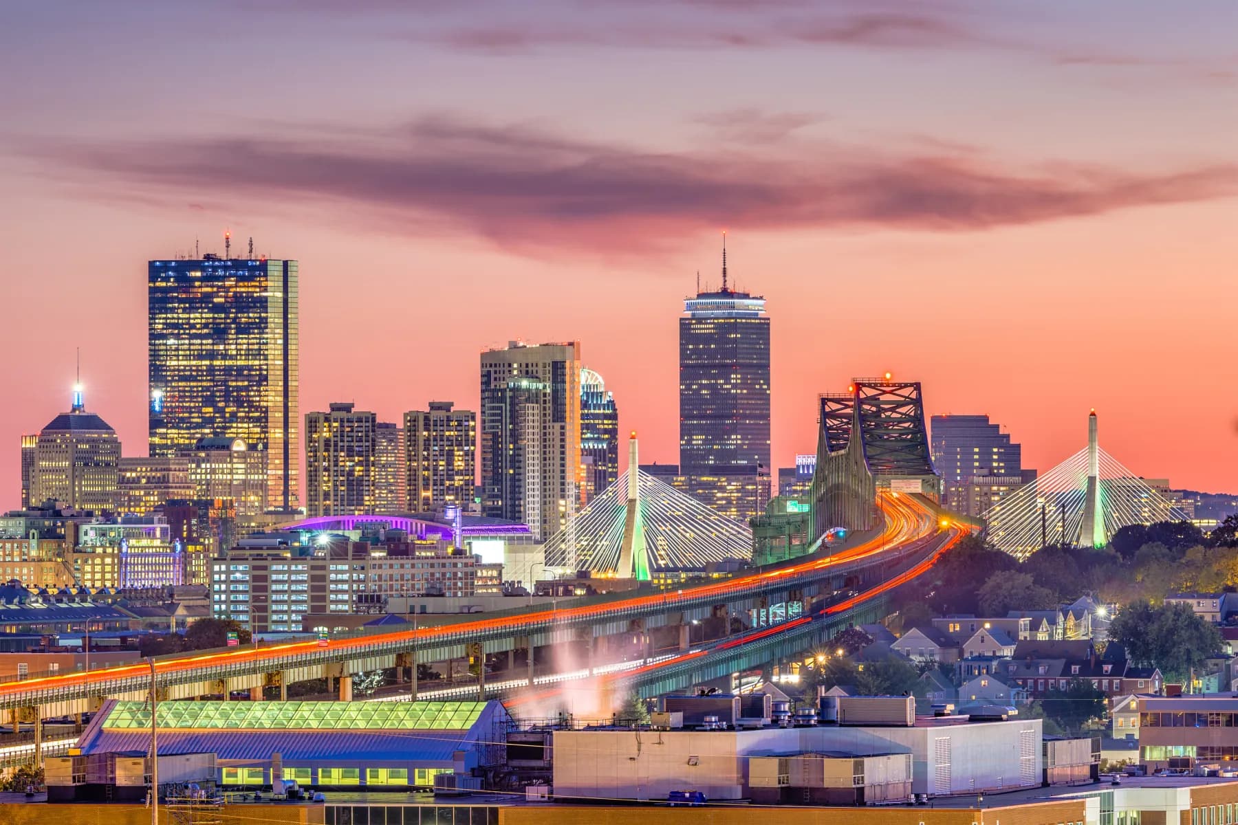 Boston skyline at sunset with the Prudential Tower, the Zakim Bridge and the Tobin Bridge
